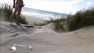 Exhibitionist Strokes Hard on the Beach