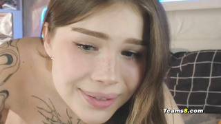 Tattooed hot shemale fingering her ass while jerking